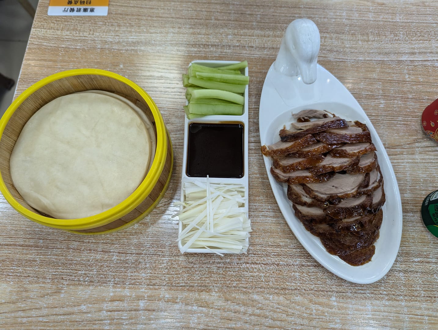 Classic Peking duck dish enjoyed at a restaurant in Beijing.