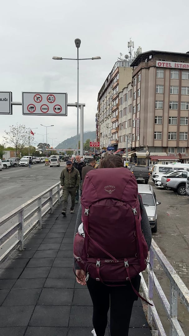 Sarah standing in Hopa, Turkey, with her backpack ready for the Turkey-Georgia border crossing
