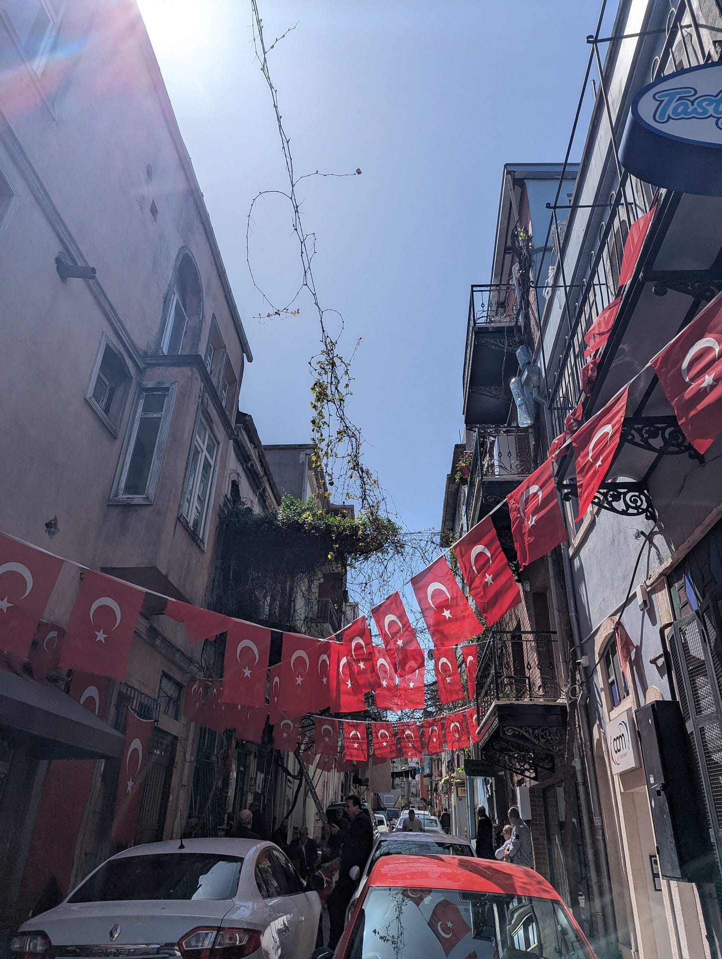 Turkish flags flying in a lively Istanbul neighborhood, one of the must-see sights and top things to do in Istanbul.