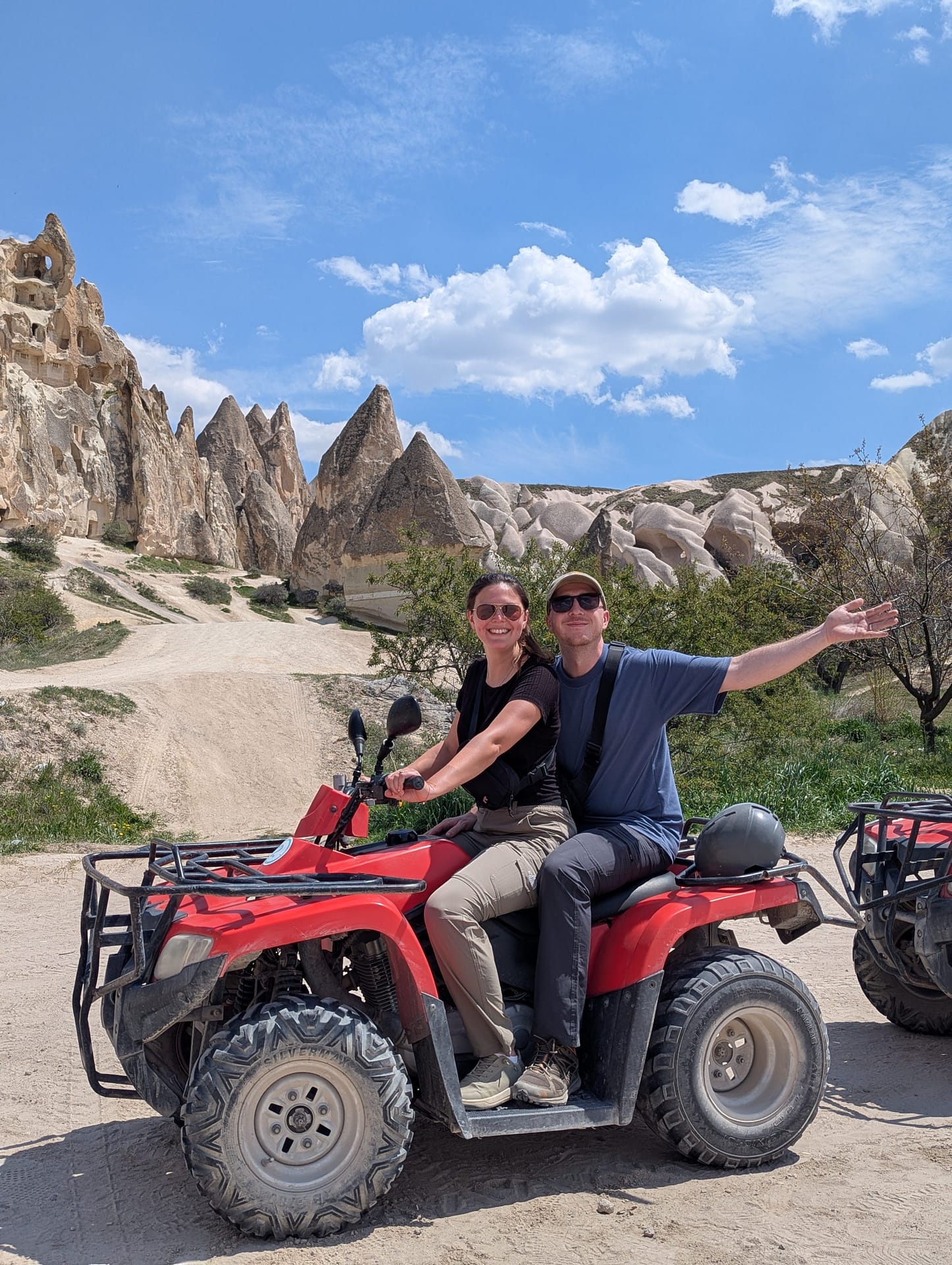 Sarah and Callum, a UK-based married couple, smiling together during their travels, representing their travel blog, Two Brits On The Go.